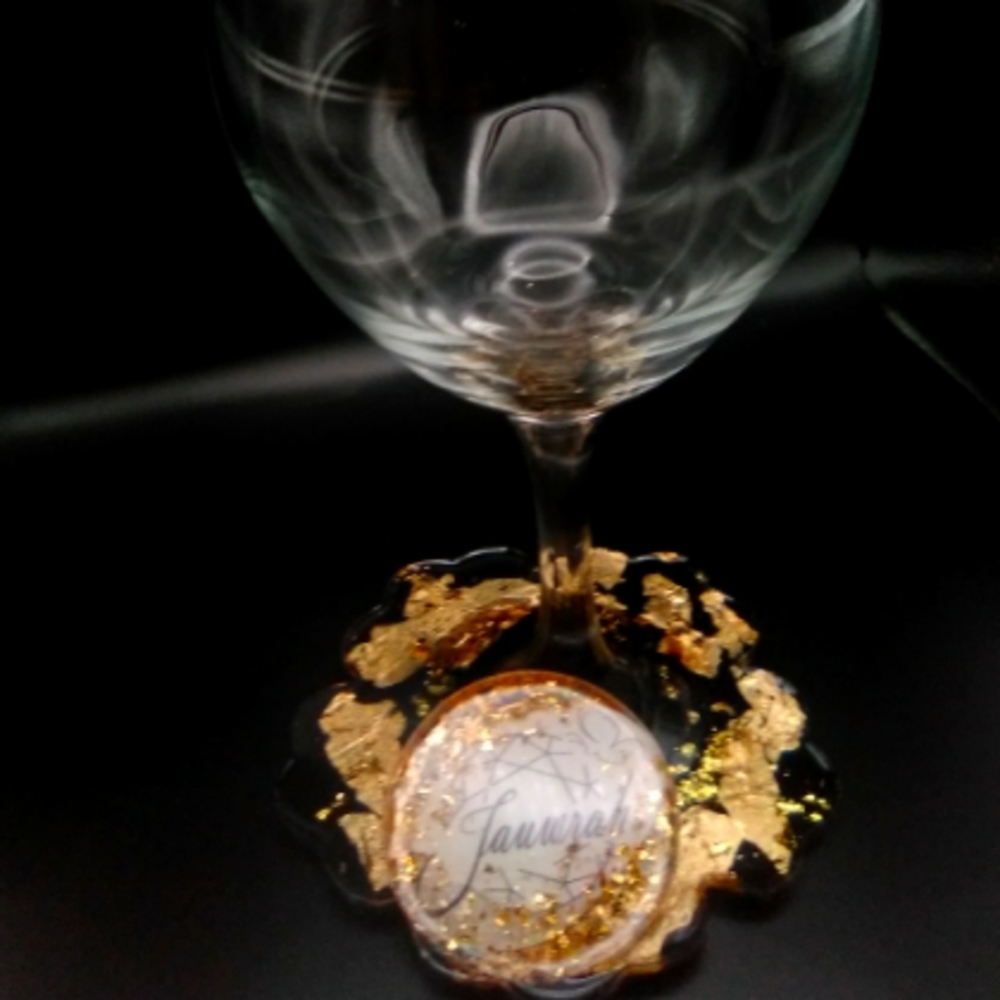 Personalized wine glass with attached coaster